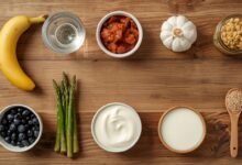 Alt text: a luxury flat lay of probiotic and prebiotic food pairings including kefir, asparagus, and kimchi on a wooden surface, 4k clinical aesthetic.